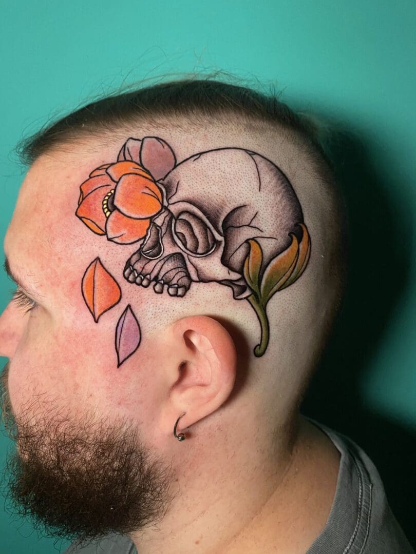 A Man With A Skull Tattoo On The Head