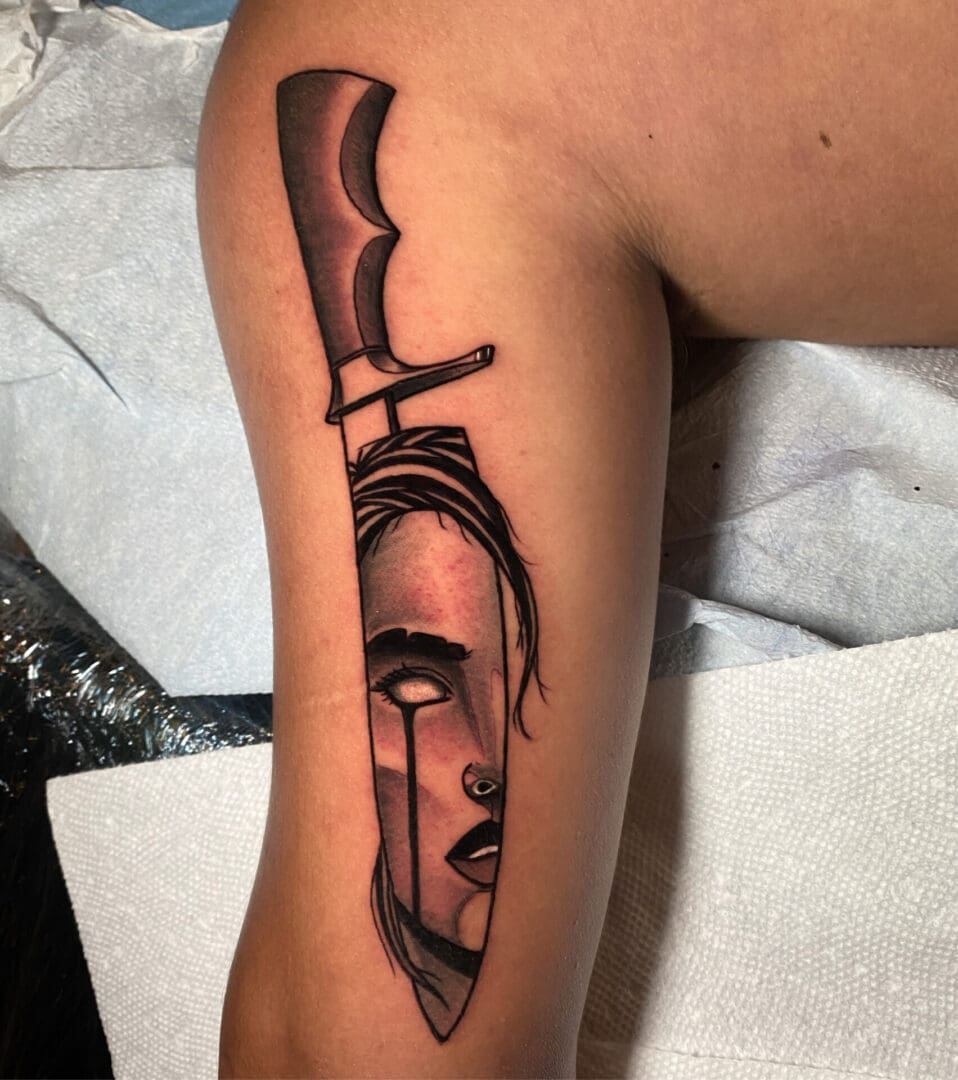 A Tattoo Of A Knife