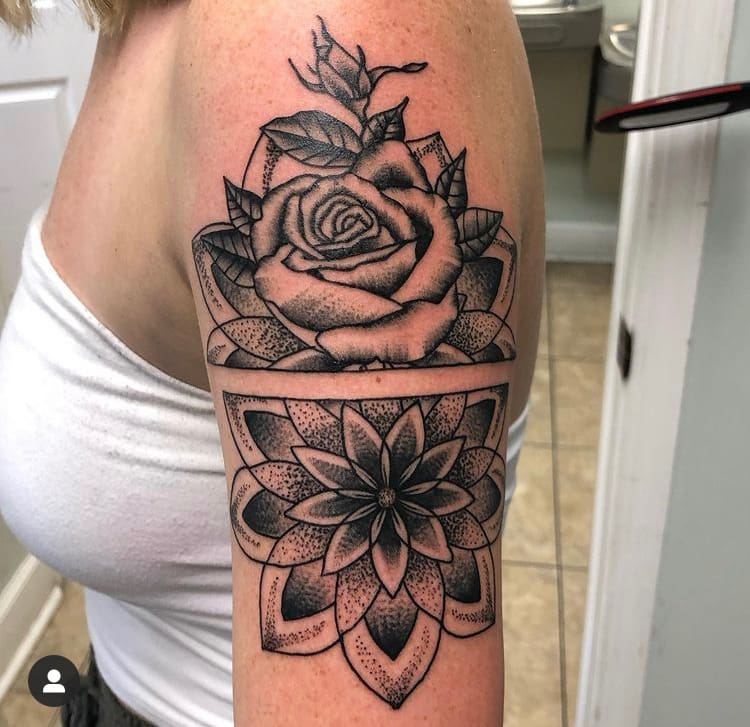 Floral rose tattoo on the arm of a woman