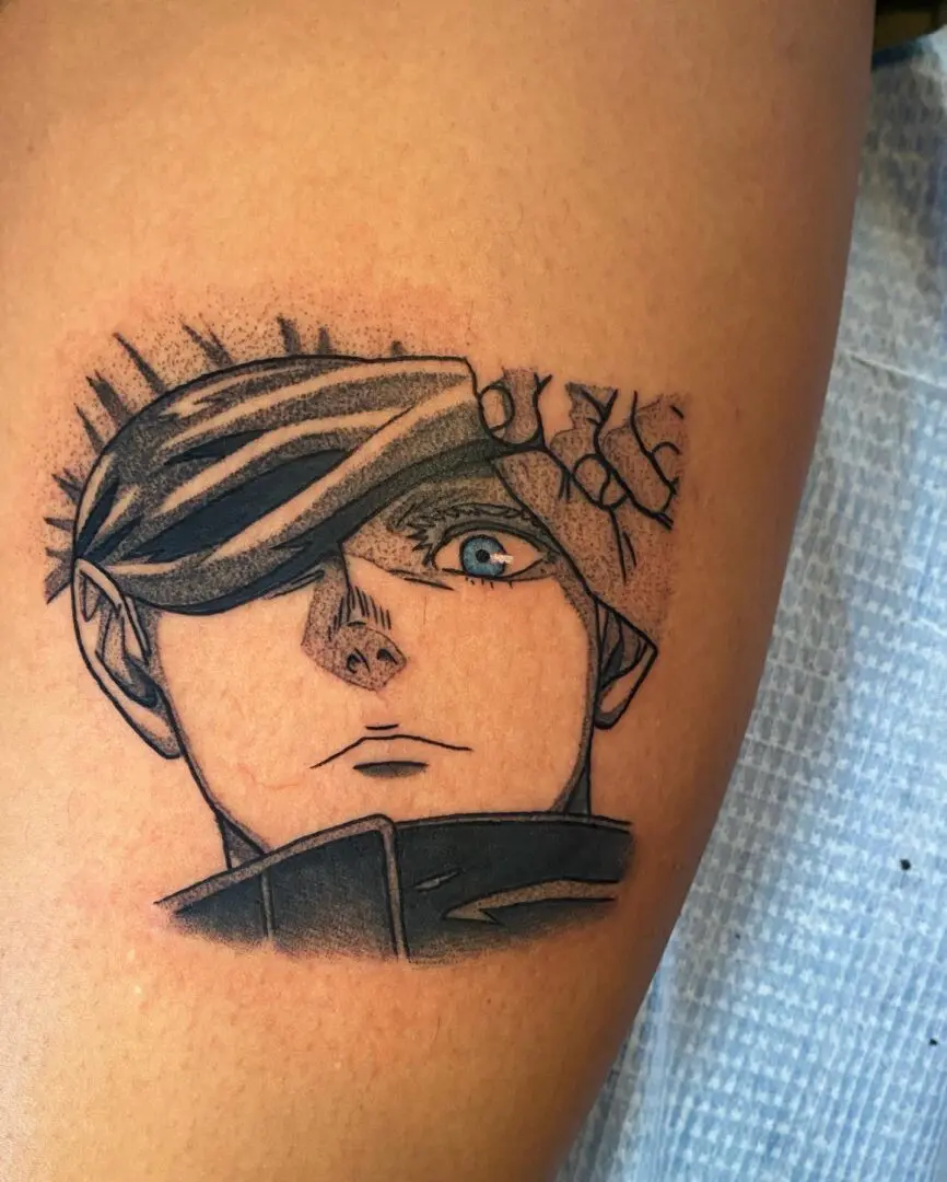An Emo Character Tattoo on an Arm Image Section in Black